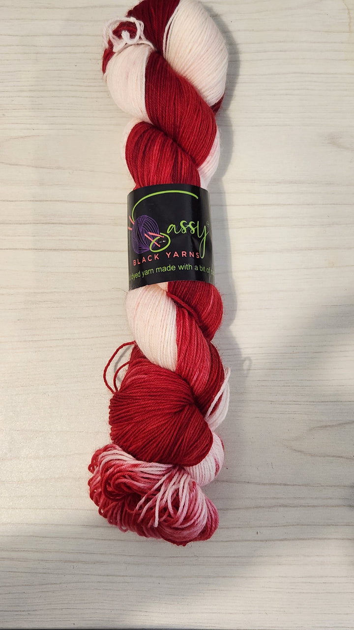 Sassy Black Yarns hand dyed yarn colorway: Strawberry Cheesecake