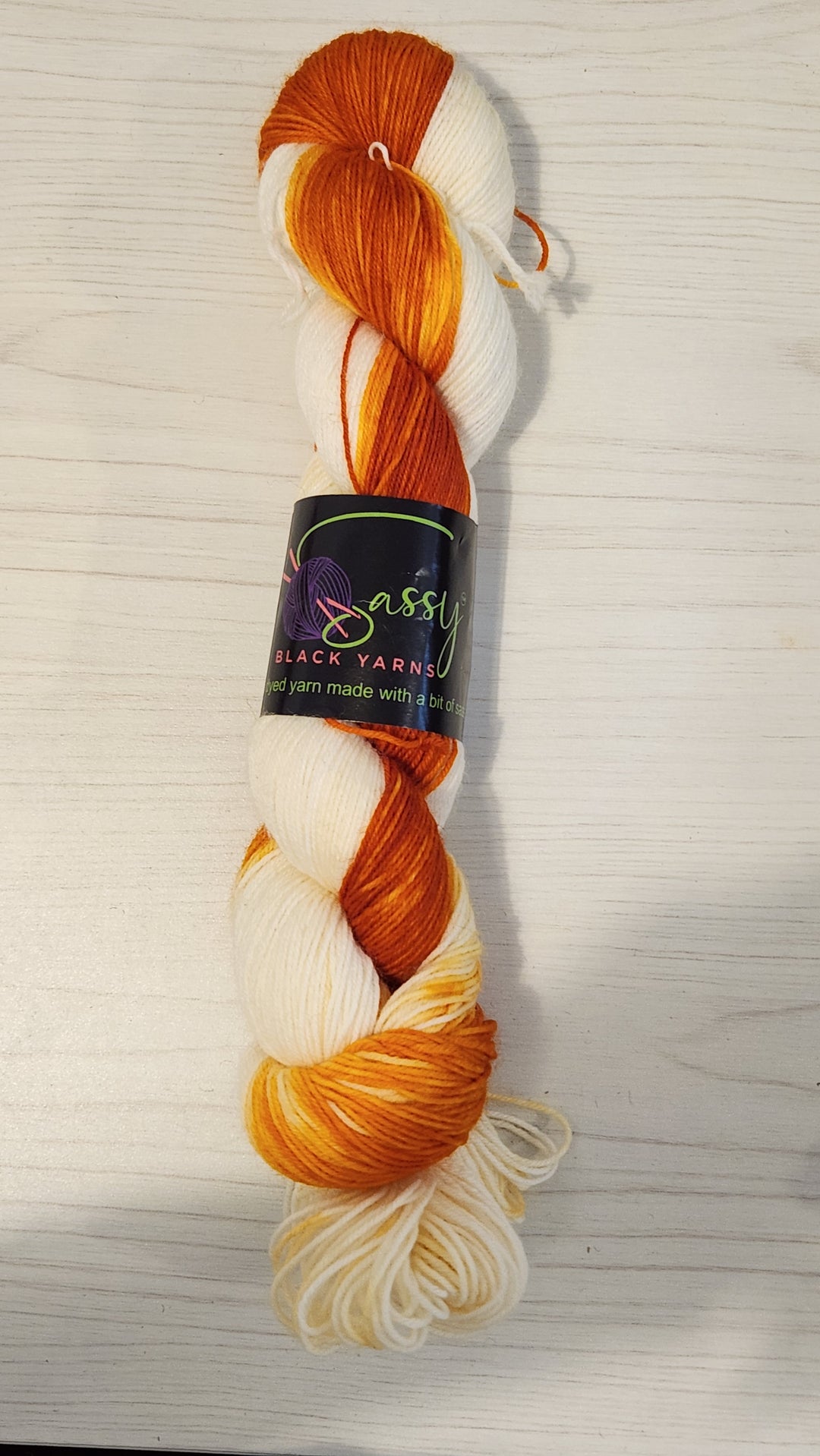 Sassy Black Yarns hand dyed yarn colorway: Creamsicle